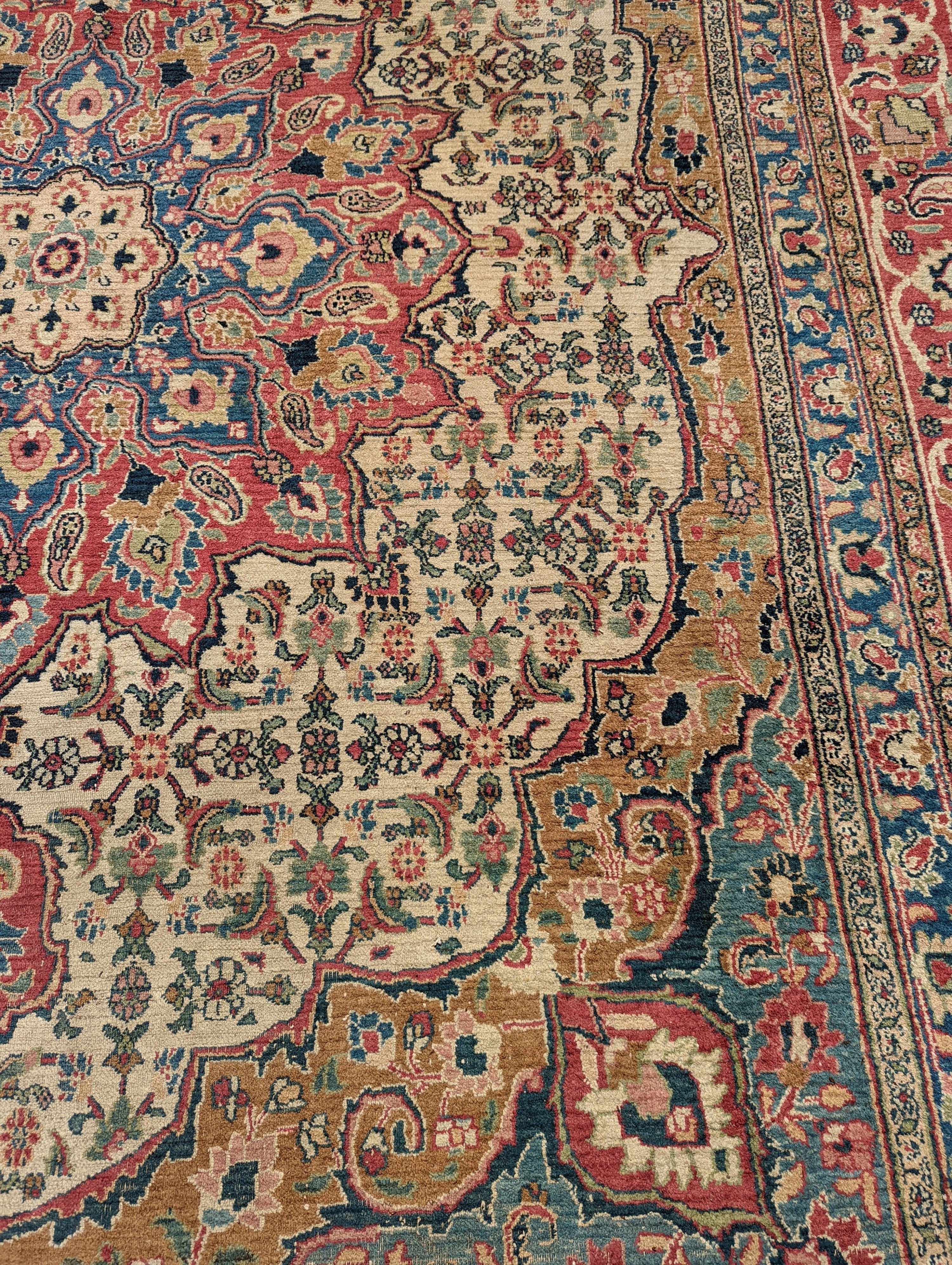 An Isfahan ivory ground carpet, 432 x 330cm